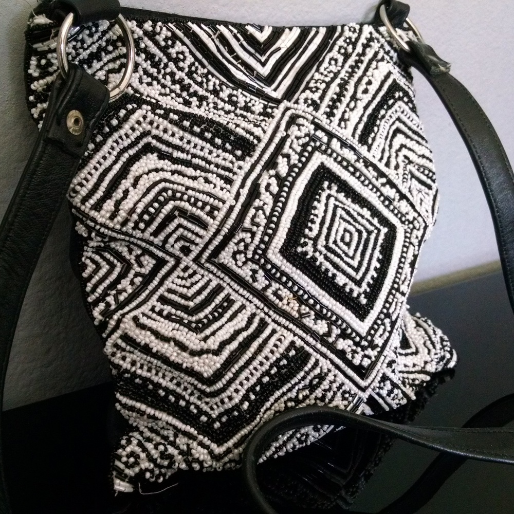 Black and white beaded cross body bag.